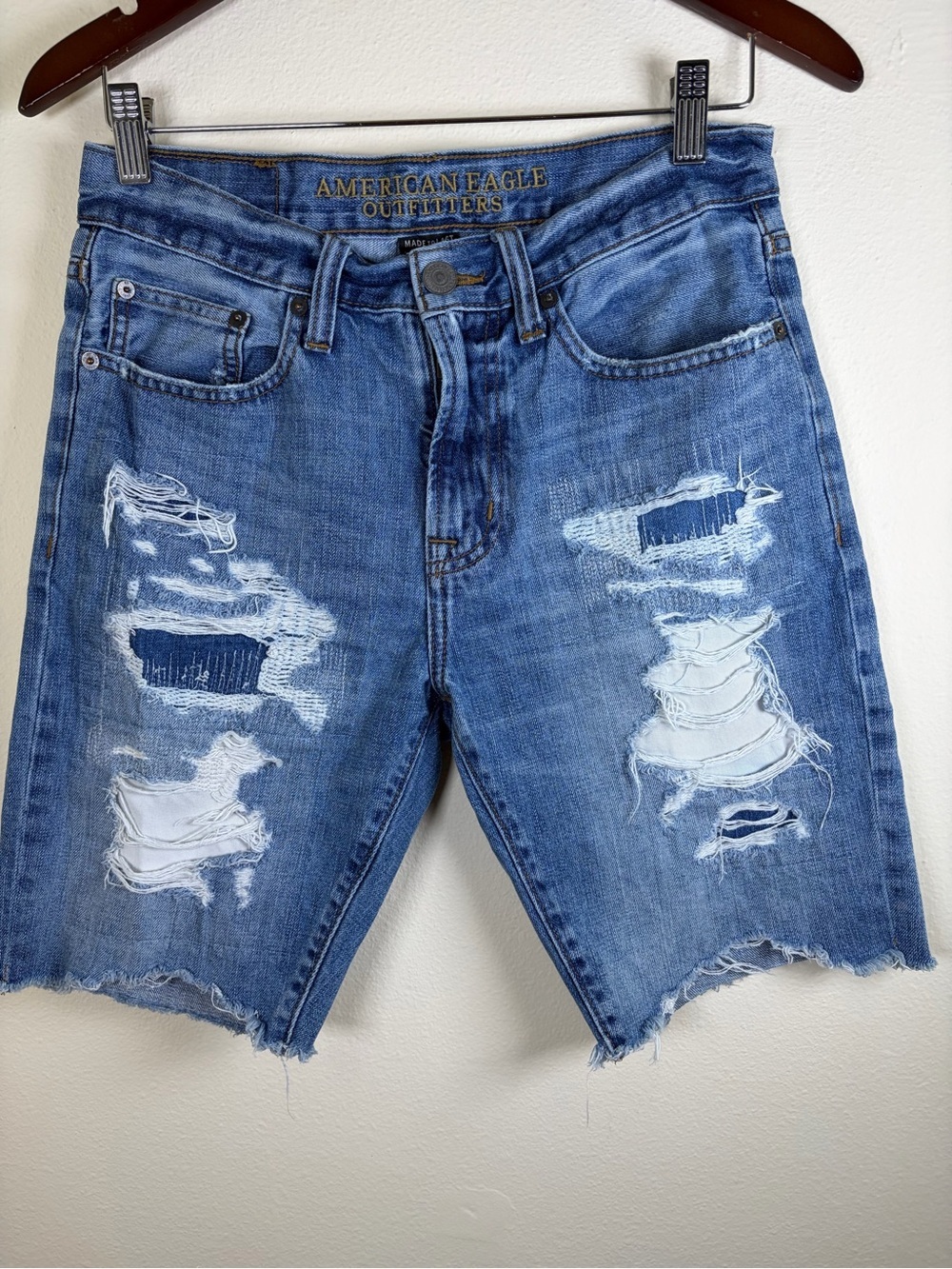 American Eagle Outfitters Distressed Denim Bermuda Shorts 28 Raw Hem Medium Wash